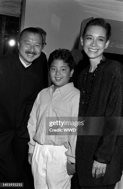 Michael Chow, model Tina Chow, and their son Maximillian Chow attend party celebrating Michael Chow's design of the new Giorgio Armani boutique on...