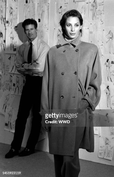Designer Calvin Klein poses with model Christy Turlington inside of Klein's New York City design studio art 205 West 39th Street.