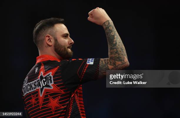Joe Cullen of England celebrates the win during his Second Round Match against Ricky Evans of England during Day Nine of The Cazoo World Darts...