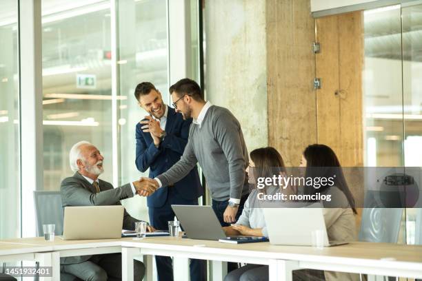group of business people working together in the office - clapping hands office stock pictures, royalty-free photos & images