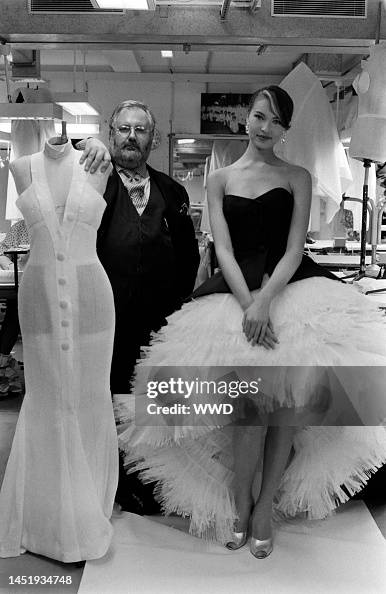 Portrait of designer Gianfranco Ferre with model in Dior's design ...