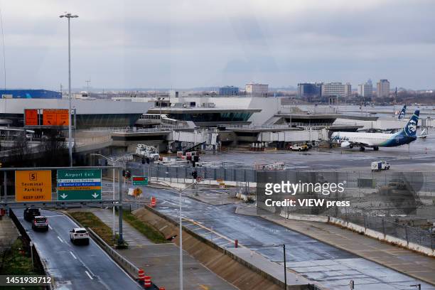 Cars drive near the Terminal 5 at JFK Airport on December 23, 2022 in New York City. Winter weather continues to disrupt holiday travel across the...