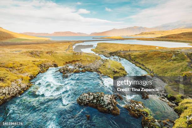 river running down to the sea, somwhere in iceland - snaefellsnes stock pictures, royalty-free photos & images