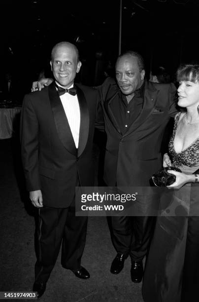 Michael Milken, Quincy Jones, and Lori Anne Hankel attend the Fire and Ice Ball, benefiting the Revlon/UCLA Women's Cancer Research Program, at the...