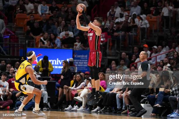 Tyler Herro of the Miami Heat attempts a three point shot during the first half against the Indiana Pacers at FTX Arena on December 23, 2022 in...