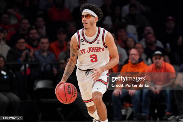 Andre Curbelo of the St. John's Red Storm dribbles the ball against the Syracuse Orange in the championship game of the Empire Classic at Barclays...