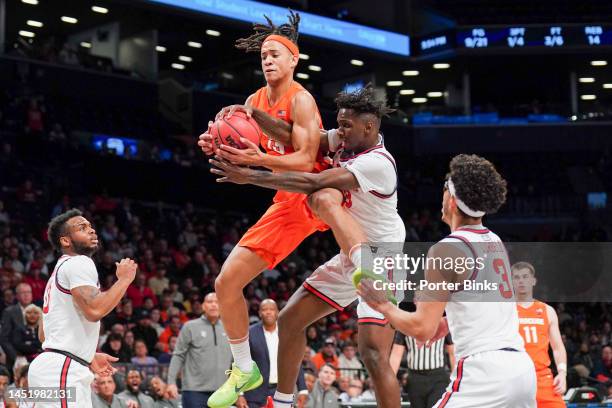 Benny Williams of the Syracuse Orange fights for a rebound with David Jones of the St. John's Red Storm in the championship game of the Empire...