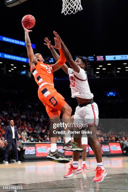 Judah Mintz of the Syracuse Orange shoots the ball against the St. John's Red Storm in the championship game of the Empire Classic at Barclays Center...