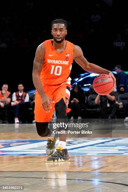 Symir Torrence of the Syracuse Orange dribbles the ball against the St. John's Red Storm in the championship game of the Empire Classic at Barclays...