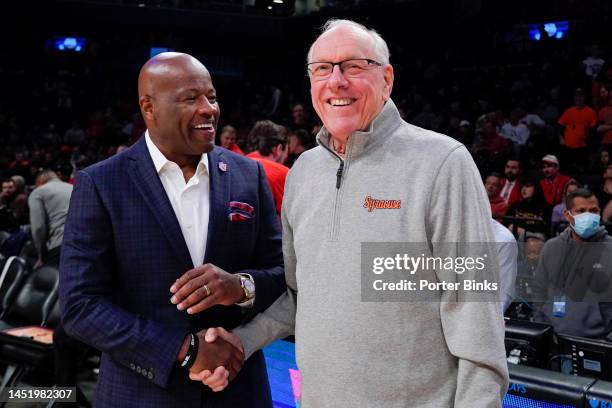 Head coach Mike Anderson of the St. John's Red Storm, greets head coach Jim Boeheim of the Syracuse Orange before the championship game of the Empire...