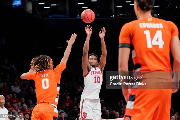 Montez Mathis of the St. John's Red Storm shoots the ball against the Syracuse Orange in the championship game of the Empire Classic at Barclays...
