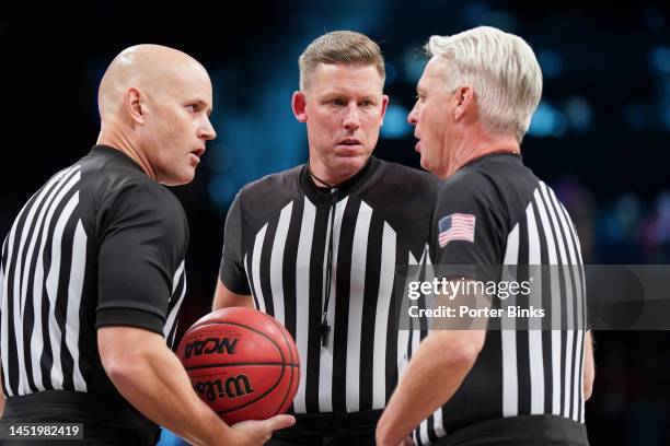 To R: NCAA referees Kipp Kissinger, Greg Evans and Brian OConnell during the game between the St. John's Red Storm and the Syracuse Orange in the...