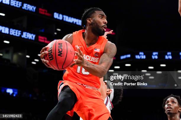 Symir Torrence of the Syracuse Orange dribbles the ball against the St. John's Red Storm in the championship game of the Empire Classic at Barclays...