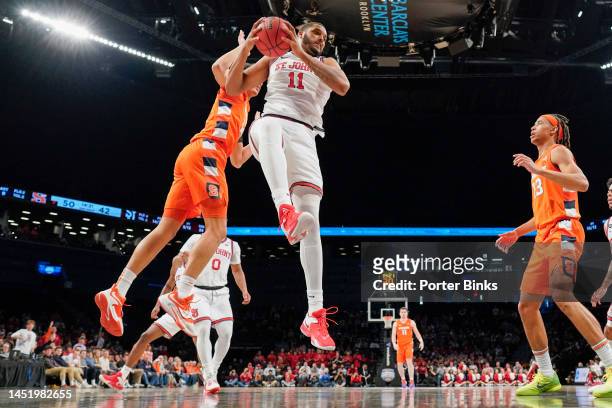 Joel Soriano of the St. John's Red Storm rebounds the ball against the Syracuse Orange in the championship game of the Empire Classic at Barclays...