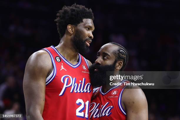 Joel Embiid and James Harden of the Philadelphia 76ers speak during the fourth quarter against the LA Clippers at Wells Fargo Center on December 23,...