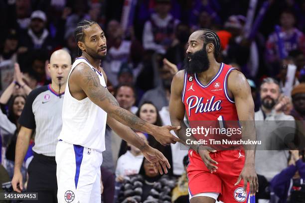 Kawhi Leonard of the LA Clippers and James Harden of the Philadelphia 76ers speak during the fourth quarter at Wells Fargo Center on December 23,...