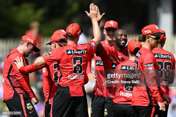 Andre Russell of the Renegades celebrates the wicket of James Neesham of the Hurricanes during the Men's Big Bash League match between the Hobart...