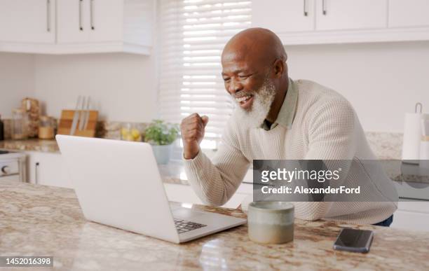 yes, winner or senior black man on laptop for trading deal success, stock market or retirement loan growth in kitchen. winning, smile or happy elderly for marketing, business or target achievement - zest ford stock pictures, royalty-free photos & images