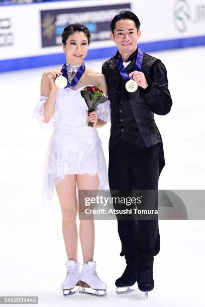 Kana Muramoto and Daisuke Takahashi of Japan pose with their gold medals during day three of the 91st All Japan Figure Skating Championships at Towa...