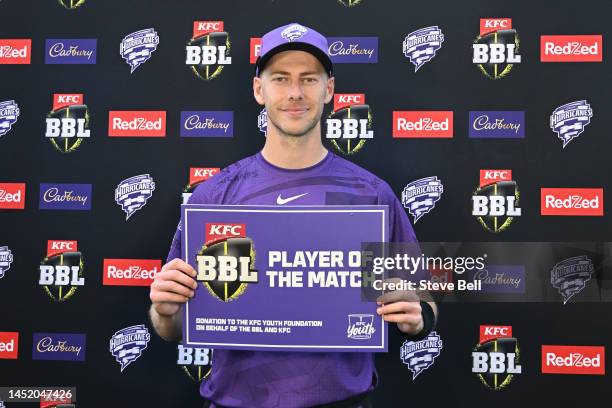 Riley Meredith of the Hurricanes receives the player of the match during the Men's Big Bash League match between the Hobart Hurricanes and the...
