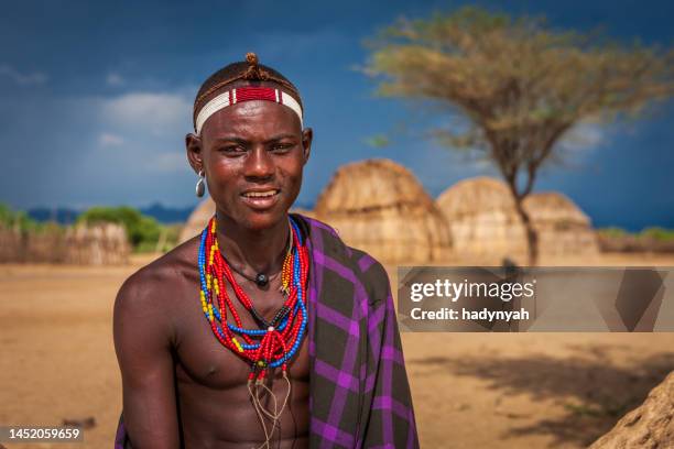 portrait of young man from erbore tribe, ethiopia, africa - african tribal images stock pictures, royalty-free photos & images