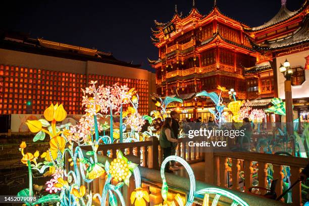 Tourists look at illuminated lanterns at the Yu Garden ahead of Chinese New Year, the Year of the Rabbit, on December 23, 2022 in Shanghai, China.