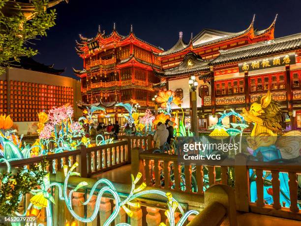 Tourists look at illuminated lanterns at the Yu Garden ahead of Chinese New Year, the Year of the Rabbit, on December 23, 2022 in Shanghai, China.