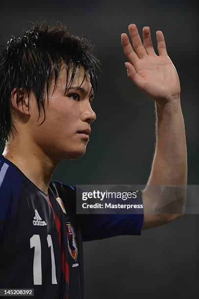 Ryo Miyaichi of Japan waves to the fans during the international friendly match between Japan and Azerbaijan at Ecopa Stadium on May 23, 2012 in...