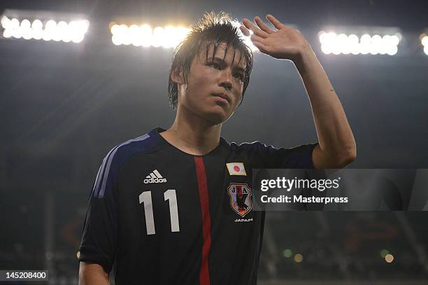 Ryo Miyaichi of Japan waves to the fans during the international friendly match between Japan and Azerbaijan at Ecopa Stadium on May 23, 2012 in...