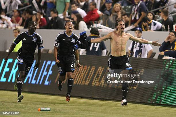 Alan Gordon of the San Jose Earthquakes celebrates his 90th minute eventual game-winning goal as teammates Ike Opara and Jason Hernandez run along...