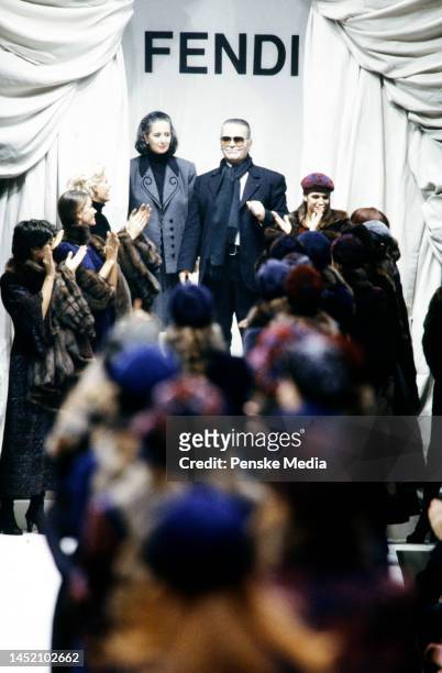 Designer Karl Lagerfeld and Paola Fendi walk on the runway at the finale of the show.