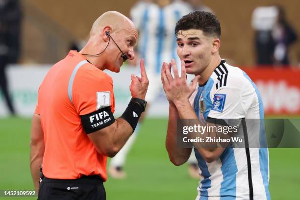 Referee Szymon Marciniak talks to Julian Alvarez of Argentina during the FIFA World Cup Qatar 2022 Final match between Argentina and France at Lusail...