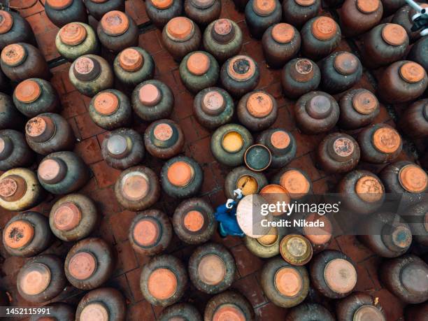 top view of jars of processing soybean jam made by traditional outdoor way under natural sunlight - hanoi stock pictures, royalty-free photos & images