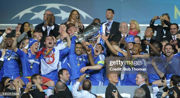 Captain Frank Lampard and Jose Bosingwa of Chelsea lift the trophy in celebration after their victory in the UEFA Champions League Final between FC...