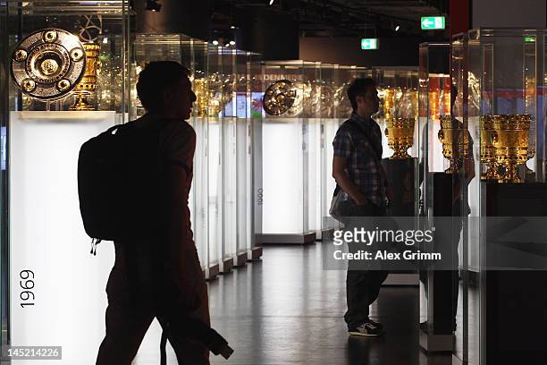 Visitors view the exhebition during the presentation of the 'Bayern Muenchen Erlebniswelt' at Allianz Arena on May 24, 2012 in Munich, Germany.