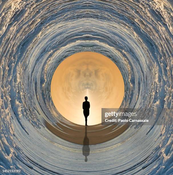 young adult pass through sea waves  looking  for better life - break through concept stockfoto's en -beelden