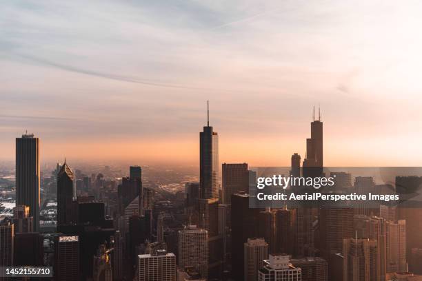 aerial view of chicago skyline at sunset - chicago skyline stock pictures, royalty-free photos & images