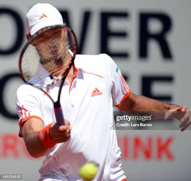 Viktor Troicki of Serbia plays a forehand during his match against Florian Mayer of Germany during day five of Power Horse World Team Cup at...