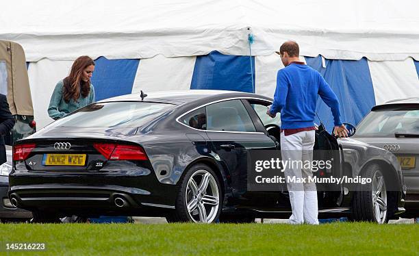 Catherine, Duchess of Cambridge and Prince William, Duke of Cambridge get into Prince William's new Audi A7 car after Prince William and Prince Harry...