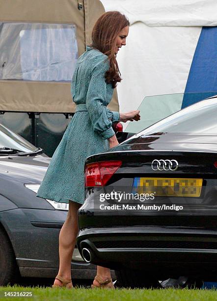 Catherine, Duchess of Cambridge gets into Prince William's new Audi A7 car after watching Prince William and Prince Harry play in the Audi Polo...