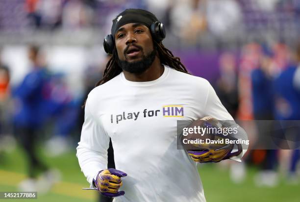 Dalvin Cook of the Minnesota Vikings warms up against the New York Giants at U.S. Bank Stadium on December 24, 2022 in Minneapolis, Minnesota.