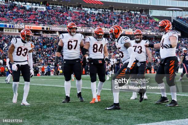 Tee Higgins of the Cincinnati Bengals celebrates with teammates after scoring a receiving touchdown during the first quarter against the New England...