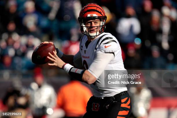 Joe Burrow of the Cincinnati Bengals attempts a pass during the first quarter against the New England Patriots at Gillette Stadium on December 24,...