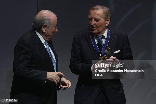 Gerhard Mayer-Vorfelder receives the Order of Merit Award from FIFA President Joseph S. Blatter during the Opening Ceremony for the 62nd FIFA...