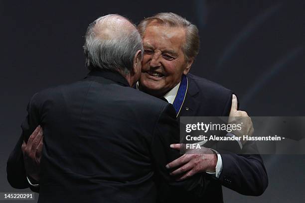 Gerhard Mayer-Vorfelder receives the Order of Merit Award from FIFA President Joseph S. Blatter during the Opening Ceremony for the 62nd FIFA...