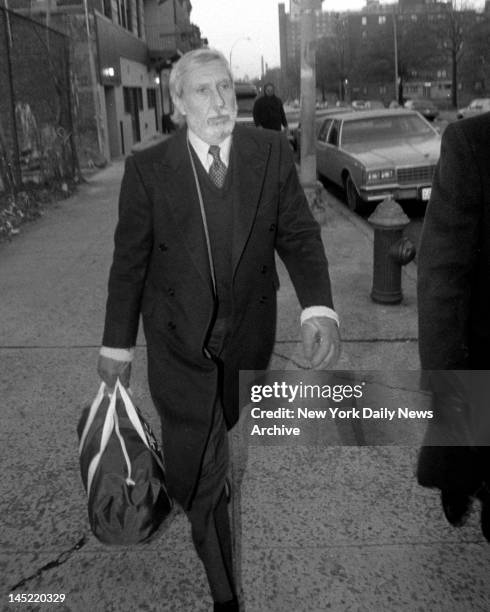 Ivan Boesky, who has paid his $100 million fine for insider trading rap, strides purposefully out of halfway house at 988 Myrtle Ave., Brooklyn, to...