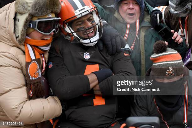 Deshaun Watson of the Cleveland Browns celebrates a touchdown with fans during the second half in the game against the New Orleans Saints at...