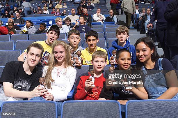 Memphis Grizzlies'' fans show off their Lorenzen Wright bobbleheads given to the first 4000 kids 14 and under before a game against the Orlando Magic...