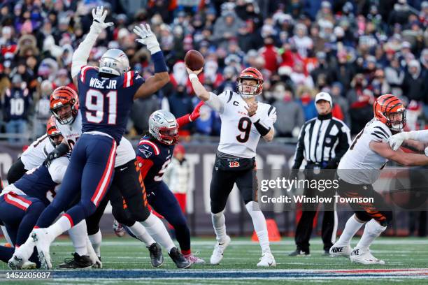 Joe Burrow of the Cincinnati Bengals attempts a pass during the first quarter against the New England Patriots at Gillette Stadium on December 24,...