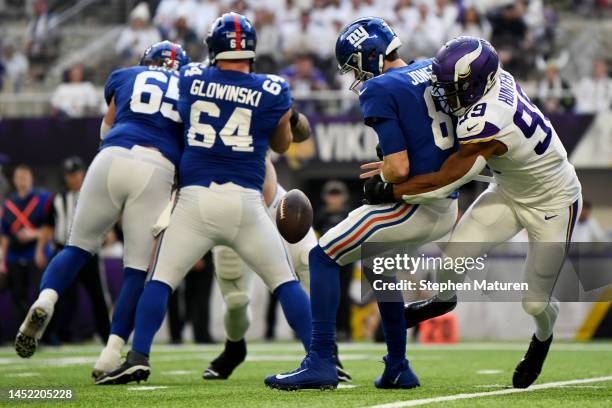 Daniel Jones of the New York Giants fumbles the ball after being hit by Danielle Hunter of the Minnesota Vikings during the first quarter at U.S....